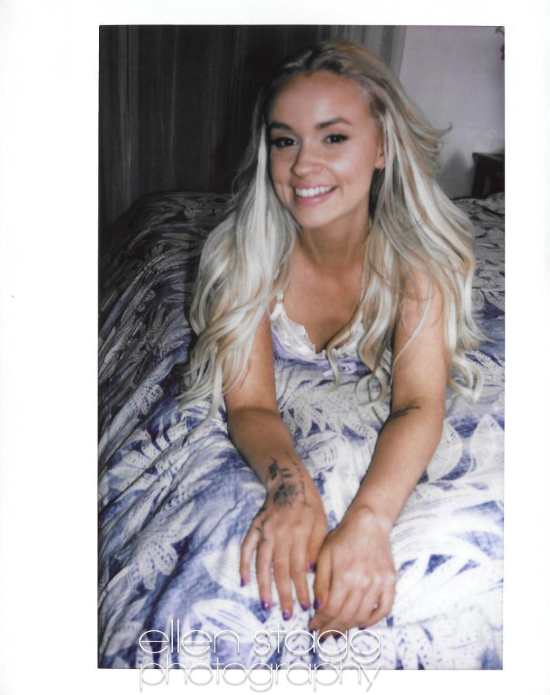 Khloe Kingsley on this big bed in a cute sundress in these one of kind polaroids