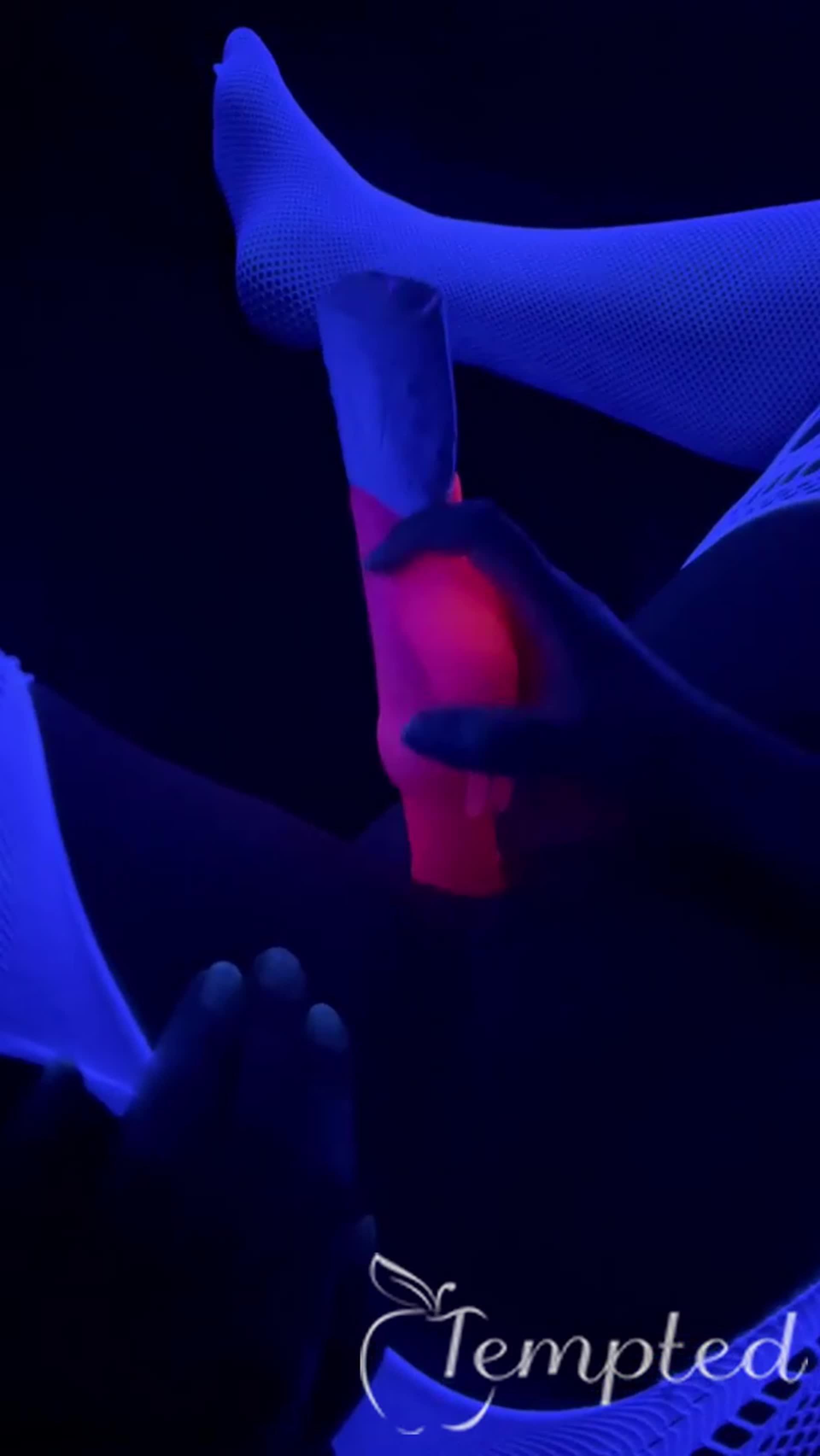 Black light fun. Bonnie Rose with her toys.